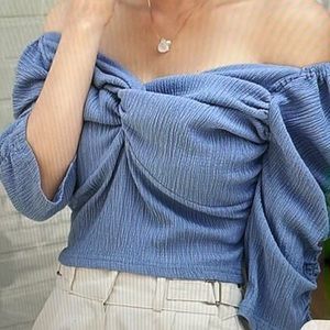 Off the shoulder blue blouse twist